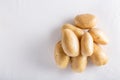 Raw organic potatoes on a white background