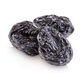 Raw organic prunes, dried plums, smoked prunes close-up on a white background. Royalty Free Stock Photo