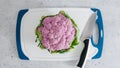 Raw organic purple cauliflower close-up on cutting board on light grey stone background Royalty Free Stock Photo