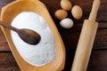 Raw organic rice flour in bowl over rustic wooden table Royalty Free Stock Photo