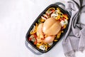 Raw organic uncooked whole chicken with bell pepper