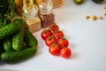 Raw organic vegetables, fruits and nuts with fresh ingredients for healthily cooking on kitchen. Vegan or diet food concept. Royalty Free Stock Photo