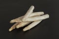 Raw organic white asparagus spears. Fresh vegetables on black background Royalty Free Stock Photo