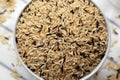 Raw Organic Wild Rice in a Bowl on a white wooden background, top view Royalty Free Stock Photo