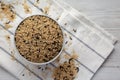 Raw Organic Wild Rice in a Bowl on a white wooden background, top view Royalty Free Stock Photo