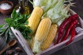 Raw Organic Yellow Corn on the Cob Ready to grill with hot chili pepper garlic and herbs. Royalty Free Stock Photo