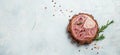 Raw Ossobuko steak marble meat with herbs and spices on light background. Long banner format. top view