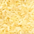 Raw parboiled long-grain rice close up Royalty Free Stock Photo