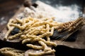 Raw pasta busiate on wooden table Royalty Free Stock Photo
