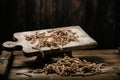 Raw pasta busiate on wooden table Royalty Free Stock Photo
