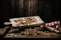 Raw pasta busiate on wooden table Royalty Free Stock Photo