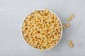 Raw pasta. Cavatappi Italian Pasta or Macaroni. Uncooked delicious pasta on gray stone background Royalty Free Stock Photo