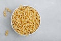 Raw pasta. Cavatappi Italian Pasta or Macaroni. Uncooked delicious pasta on gray stone background Royalty Free Stock Photo