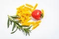 Raw pasta, fresh vegetables, tomatoes and mushrooms on a white background Royalty Free Stock Photo