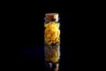 raw pasta in glass jar, wine glass. in bucket. raw pasta on black background. front view raw pasta, dropped from hand, place for Royalty Free Stock Photo