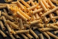 Raw pasta on grey background, top view. Dry pasta close up. generative ai Royalty Free Stock Photo
