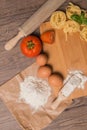Raw pasta, tomato and eggs Royalty Free Stock Photo