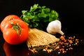 Raw pasta with vegetables and spices, ingredients for pasta Royalty Free Stock Photo