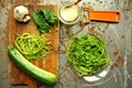 Raw pasta with zucchini and spinach pesto with garlic