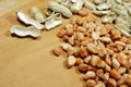 Raw Peanut Kernels and Empty Peanut Shells on Wooden Table Royalty Free Stock Photo