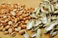 Raw Peanut Kernels and Empty Peanut Shells on Wooden Table Royalty Free Stock Photo