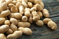 Raw peanuts on old wooden boards. Royalty Free Stock Photo