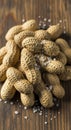 Raw peanuts on wooden surface with salt Royalty Free Stock Photo