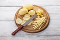 Raw peeled and sliced potatoes on cutting board Royalty Free Stock Photo