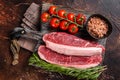 Raw Picanha meat steak, traditional Brazilian beef cut with thyme. Wooden background. Top view