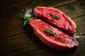 Raw Picanha steak on wooden background in rustic style