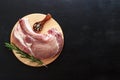 A raw piece of pork antiquote meat on a wooden round stand. View top copy space