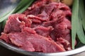 Raw pieces of crude meat with green onion