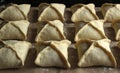 Raw pies in the form of squares in rows on a baking cart Royalty Free Stock Photo