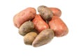 Raw pink potato tubers on a white isolated background.Potatoes in the skin