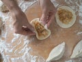 Raw pirozhki with cabbage in the cooking process. Royalty Free Stock Photo