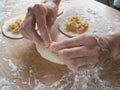 Raw pirozhki with cabbage in the cooking process. Royalty Free Stock Photo
