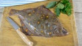 Raw plaice fish on a table Royalty Free Stock Photo