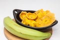 Raw plantain cups, patacones and pieces Royalty Free Stock Photo