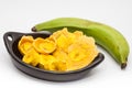 Raw plantain cups, patacones and pieces Royalty Free Stock Photo