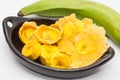 Raw plantain cups, patacones and pieces Royalty Free Stock Photo