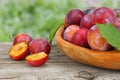 Raw plum on old wooden table Royalty Free Stock Photo