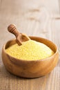 Raw polenta in a wooden bowl Royalty Free Stock Photo