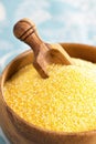 Raw polenta in a wooden bowl Royalty Free Stock Photo