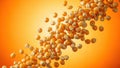 Raw popcorn kernels falling and scattering in motion against a vibrant orange and yellow gradient background, creating a dynamic Royalty Free Stock Photo