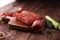 Raw pork and beef ground meat and vegetables. Royalty Free Stock Photo