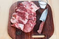 Raw pork chops. Arrangement on a cutting board. Royalty Free Stock Photo