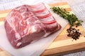 Raw pork chops, spices and rosemary on cutting board. Ready for cooking. Royalty Free Stock Photo