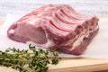 Raw pork chops, spices and rosemary on cutting board. Ready for cooking. Royalty Free Stock Photo