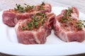 Raw pork chops, spices and rosemary on cutting board. Ready for cooking. Royalty Free Stock Photo