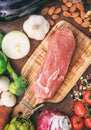 Raw pork fillet on wooden background. Fresh, healthy, uncooked pig meat on wood cutting board Royalty Free Stock Photo